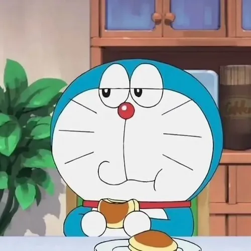 Meme Doraemon mang dáng mặt to cùng mắt lớn dí dỏm.